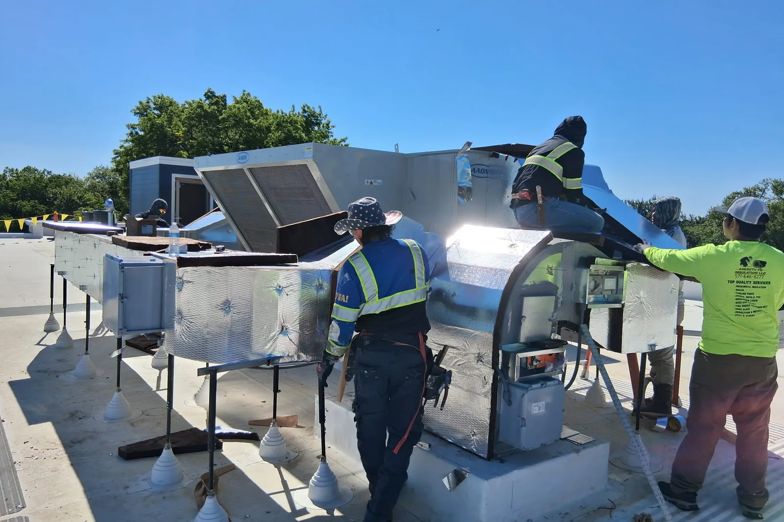 Sabaoth FQ Insulation crew in company shirts on a commercial jobsite