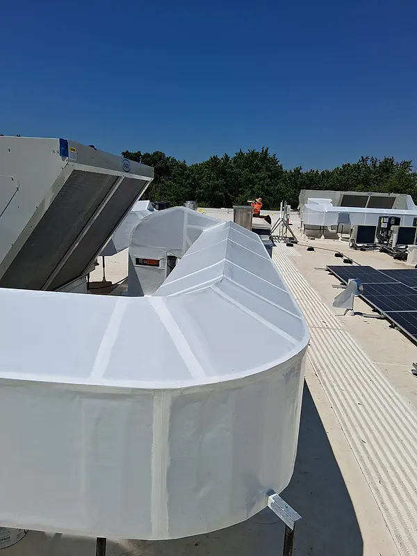 Rounded bullnose detail on wrapped rooftop ductwork