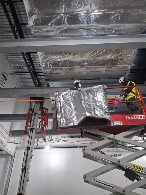 Material hoist during an interior insulation installation
